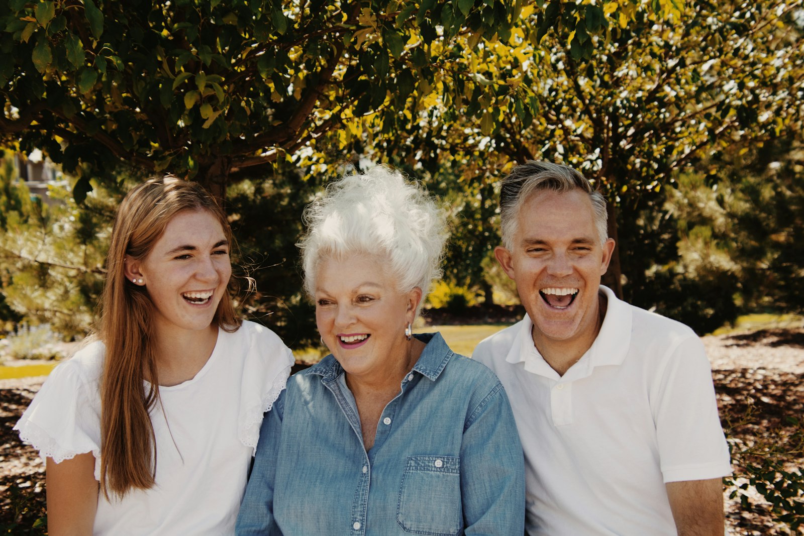 Three generations of a family laughing together